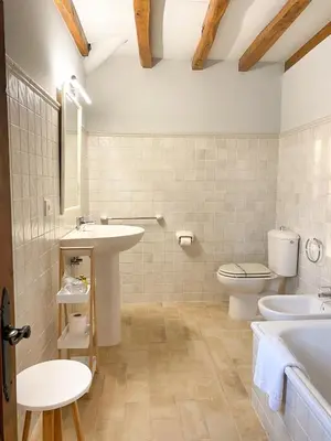 a bathroom with a sink and a toilet at Casa Pastur in Serantes