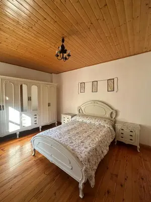 a bedroom with a bed and a wooden ceiling at Casa Rural Melon in Melón