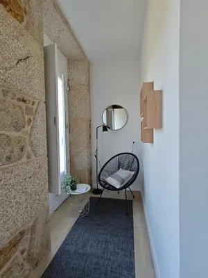 a room with two bunk beds and a chair at Villa Vieira in A Escravitude