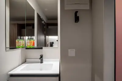 a bathroom with a sink and a mirror at Lemonade Stays Santiago de Compostela in Santiago de Compostela