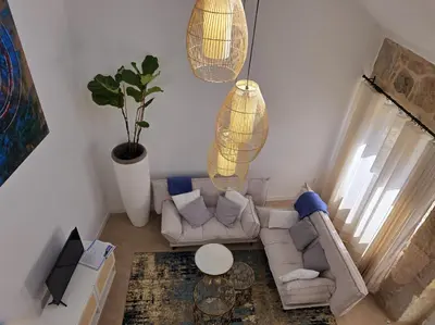 a living room with a couch and a table at Casa Rural Abreu Do Louro in Arbo