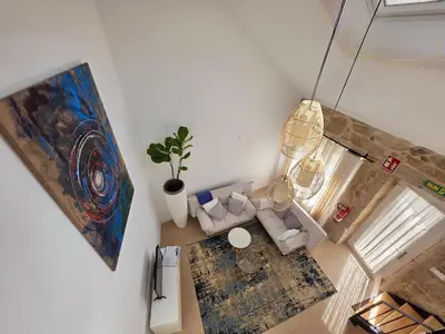 an overhead view of a living room with a couch at Casa Rural Abreu Do Louro in Arbo