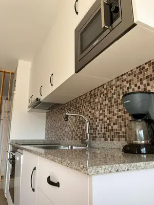 a kitchen with a sink and a mixer on a counter at Casa Rural Abreu Do Louro in Arbo
