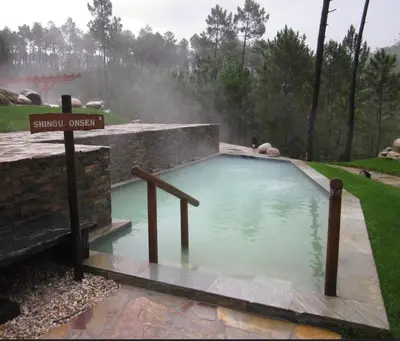 a swimming pool with a sign that reads survival oxygen at casa habana in Carballino