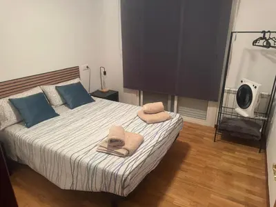 a bedroom with a bed with towels on it at casa habana in Carballino