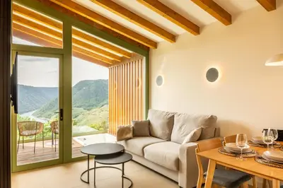 a living room with a couch and a table at Cabañas Ribeira Sacra in Parada del Sil