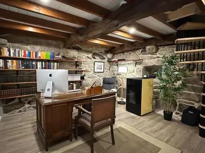 an office with a desk with a computer on it at Casa Camu in Covelo