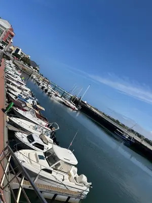 a group of boats are docked at a marina at Recuncho do Susiño in Foz