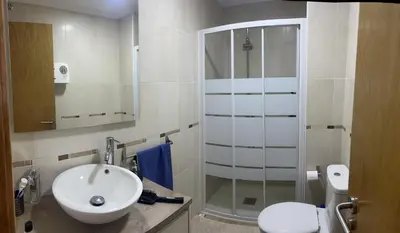 a bathroom with a sink and a shower at Recuncho do Susiño in Foz