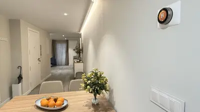a dining room with a table with oranges on it at Apartamento Ourense Vello - en el centro del casco histórico in Ourense