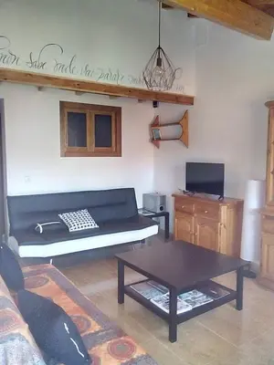 a living room with a couch and a table at A Casa da Boa Xente VUT-OU-1329 in Verín