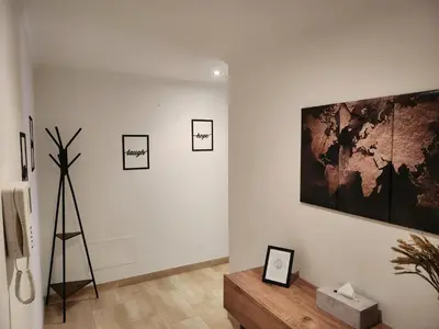 a living room with a large painting on the wall at CREDENCIAL Avda BECERREA in Sarria