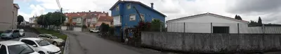 a blue house on the side of a street at Besbello Suites - Estudio in Santiago de Compostela