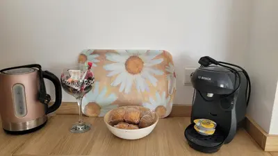 a kitchen counter with a coffee maker and a blender at Besbello Suites - Estudio in Santiago de Compostela