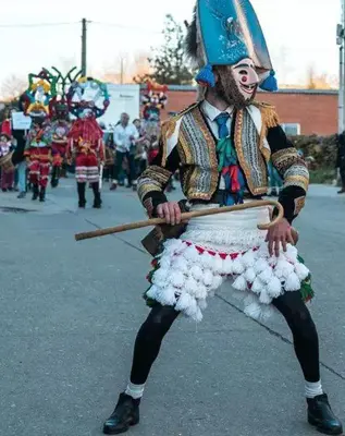 a man dressed up as a clown in a parade at Motel Cancun Barbadas-Ourense in Os Fornos