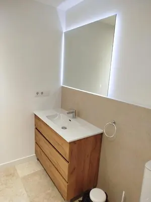 a bathroom with a sink and a mirror at XELIÑA d in A Estrada