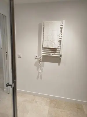 a white wall with a air conditioner in a room at XELIÑA d in A Estrada