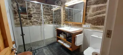 a bathroom with a shower and a sink at Casa dos ánxeles VUT-OR-1310 in Trasmiras