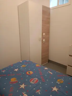 a bedroom with a bed with stars on it at Piso en Pontedeume enfrente hotel Eumesa in Puentedeume
