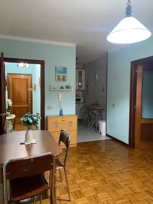 a living room with a table and a dining room at Playa a Rapadoira - Foz in Foz