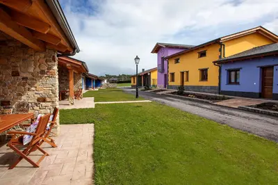 a row of colorful buildings on a street at El Capricho de Gonzalo in Cartavio