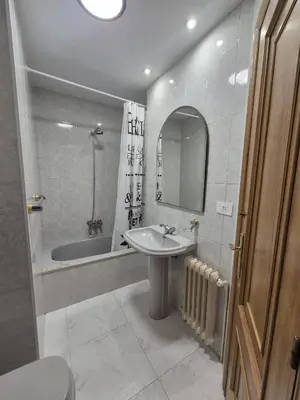 a bathroom with a sink and a bath tub at Alfonso X Lucus Confort in Lugo