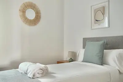 a bedroom with a bed and a mirror on the wall at A Paradiña de Sarria in Sarria