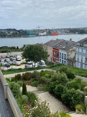 a view from the balcony of a building with a garden at Apartamento Miramar Ribadeo in Ribadeo