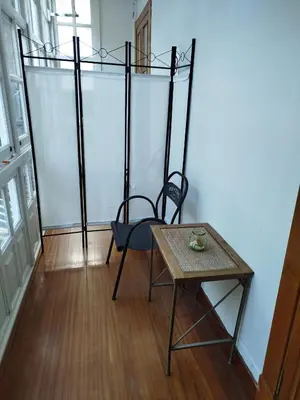 a room with a table and two chairs and a table and a tableablish at Pensión 5 Caminos in Santiago de Compostela