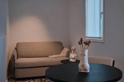 a living room with a couch and a table at Hotel Gaio 7 in Santiago de Compostela