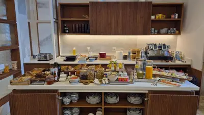 a kitchen counter with a lot of food on it at Hotel Gaio 7 in Santiago de Compostela