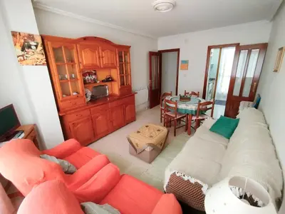 a living room with a couch and a table at Vivienda Maceda in Maceda