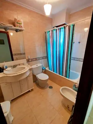 a bathroom with a sink and a toilet and a shower at Vivienda Maceda in Maceda