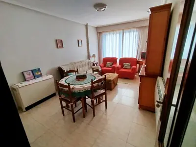 a living room with a table and chairs at Vivienda Maceda in Maceda
