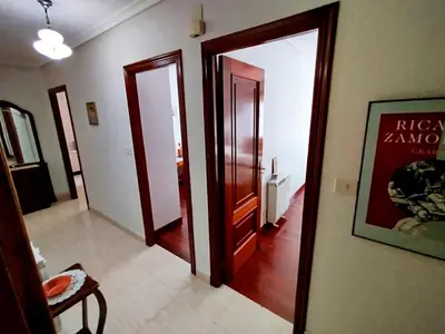 a hallway with two open doors in a room at Vivienda Maceda in Maceda