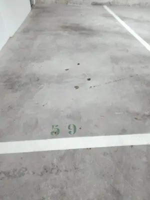 a parking lot with the number six on the ground at Estudio panorámico in Lugo