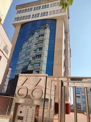 a building with a washing machine in front of it at Estudio panorámico in Lugo