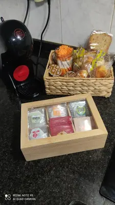 a wooden tray of food and two baskets of food at Piso céntrico en Padrón in Padrón
