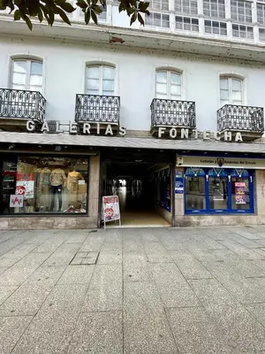 a store front with a sign in front of it at Apartamento Cardenal Monforte in Monforte de Lemos