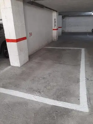an empty parking garage with a car parked in it at Apartamento cerca del centro, y la playa in Viveiro