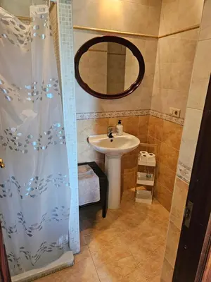 a bathroom with a toilet and a tub and a sink at El pisito de iker in Mondariz