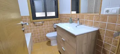 a bathroom with a sink and a toilet at Apartamento A Cañiza in La Cañiza