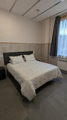 a bedroom with a large bed in a room at Calm Stay in Teo