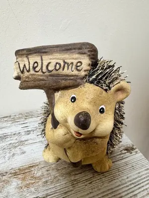 a teddy bear holding a sign that says welcome at Apartamento Océano VI in Villadaíde