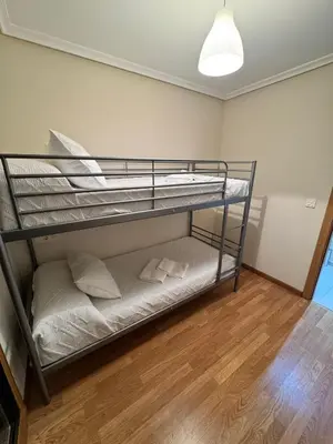 a bedroom with two bunk beds in a room at Apartamento Herosa 2 Spa in San Miguel de Reinante