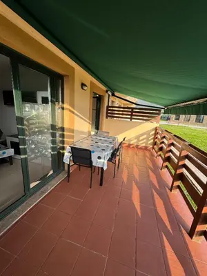 a patio with a table and chairs on a roof at Apartamento Herosa 2 Spa in San Miguel de Reinante