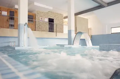 a large swimming pool with a water fountain at Apartamento Herosa 2 Spa in San Miguel de Reinante