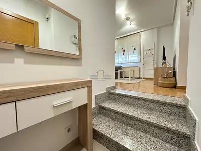 a hallway with stairs in a house at Termas de Ourense in Ourense