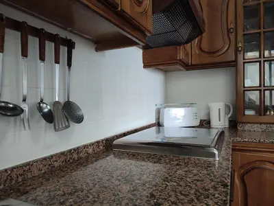 a kitchen with a counter top with a toaster oven at Piso Fenuca in Ourense