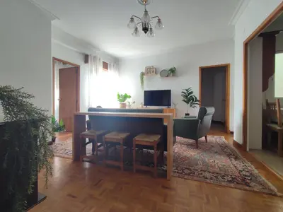 a living room with a table and chairs at Piso Fenuca in Ourense